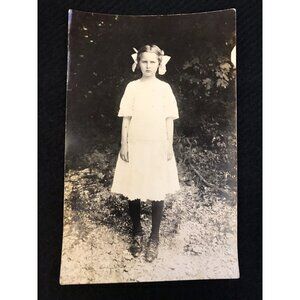 RPPC c1900 Girl Fashion Hair Bows Scowl Outside Picture Real Photo Postcard